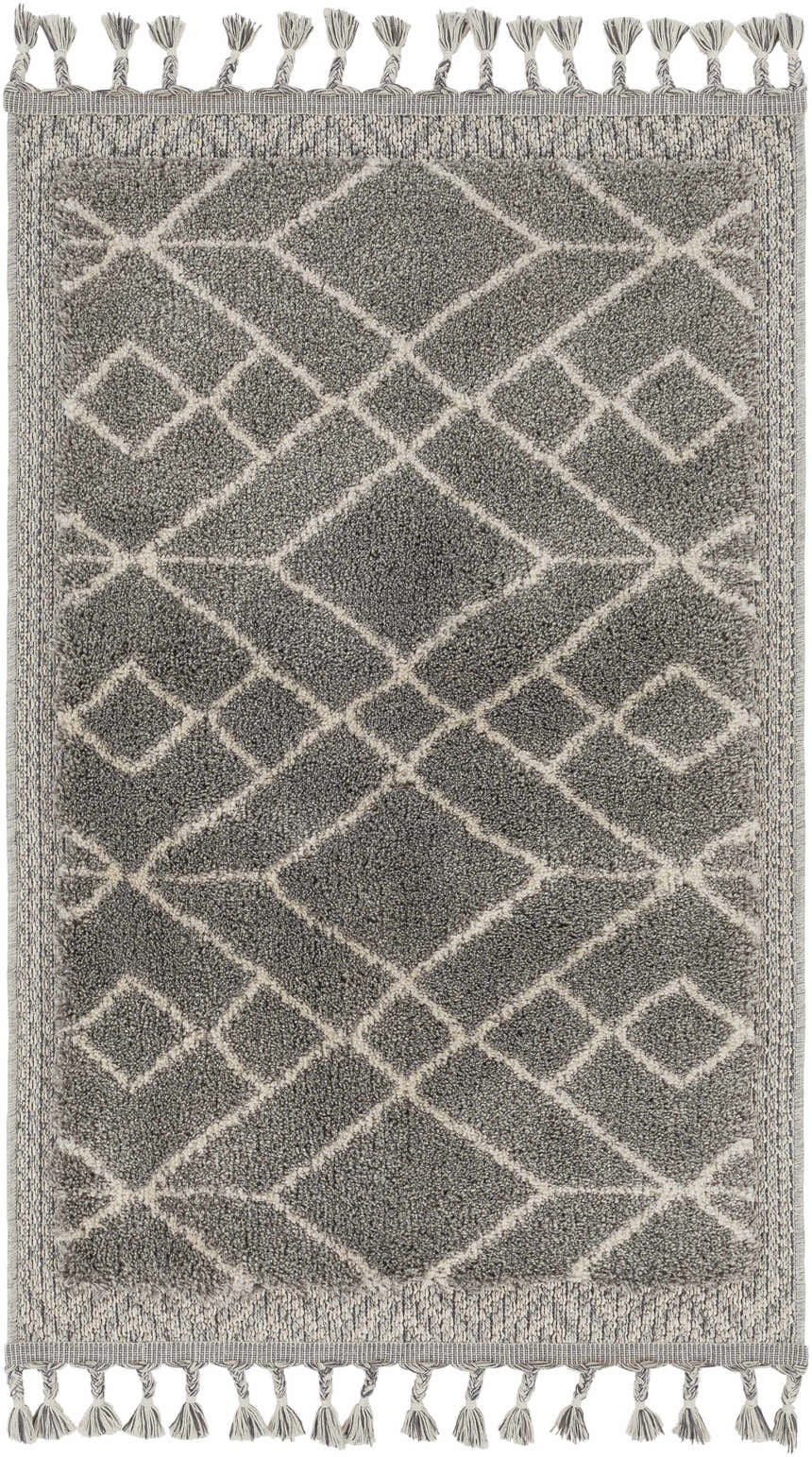 Close-up of the Ballybunnion Area Rug. Charcoal rug with light beige geometric diamond pattern and decorative tassels. Design-Rectangle-23