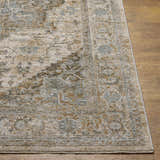 Close-up of the Ballisodare Thick Luxe Boutique Rug showing its beige, taupe, and teal traditional pattern. Front