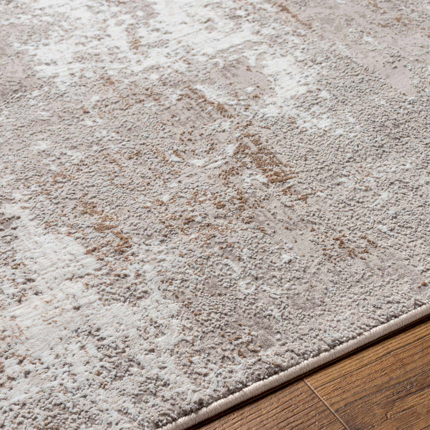 Close-up of the Binabaan Abstract Area Rug showing its charcoal, tan, and ivory textured design. Texture