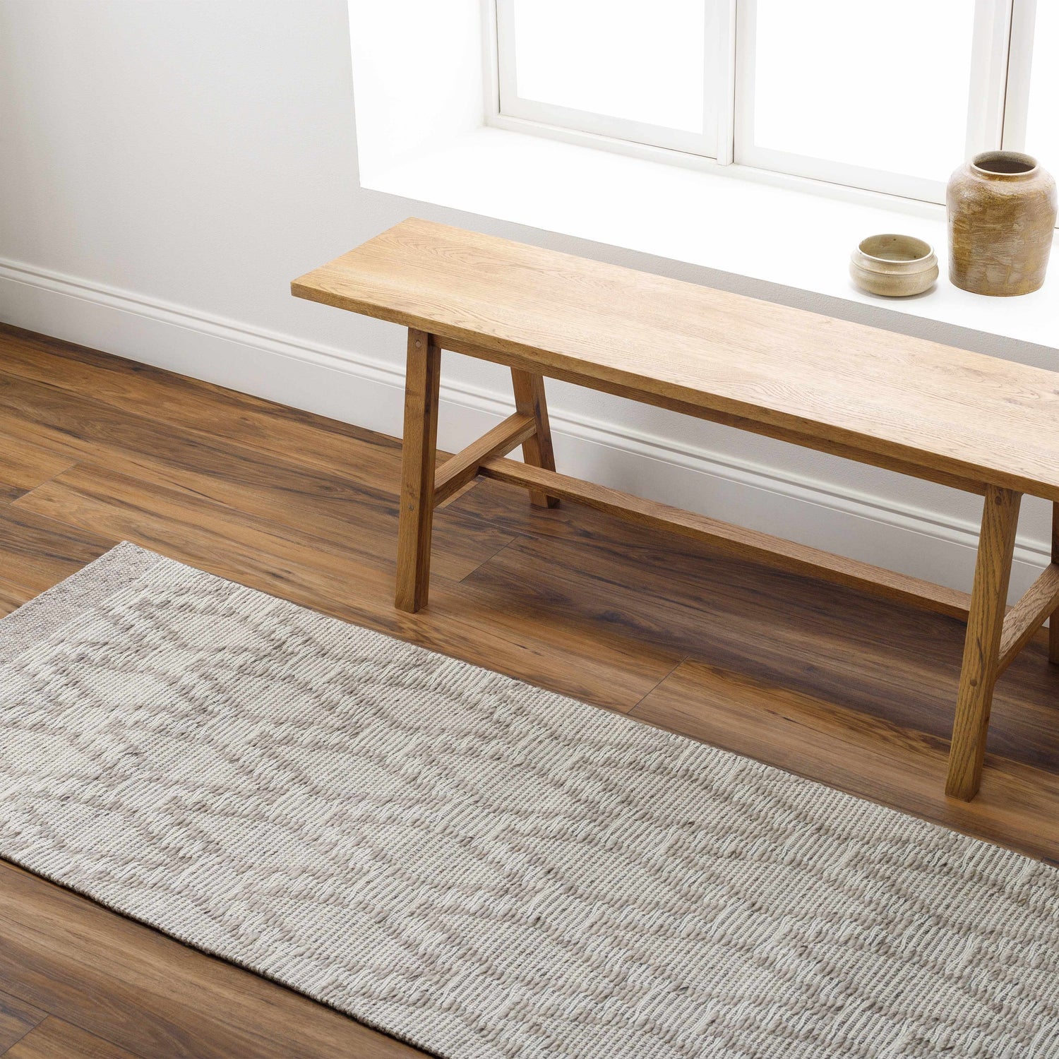 Entryway scene with a mocha and off white Boys Area Rug - Clearance, wooden bench, and natural light. Roomscene-Runner