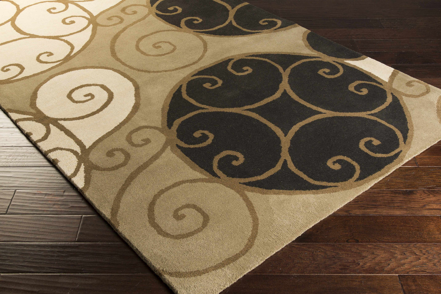 Close-up of the hand-tufted Bray Area Rug. Beige, brown, and black swirls on a wool rug with a contemporary design. Corner