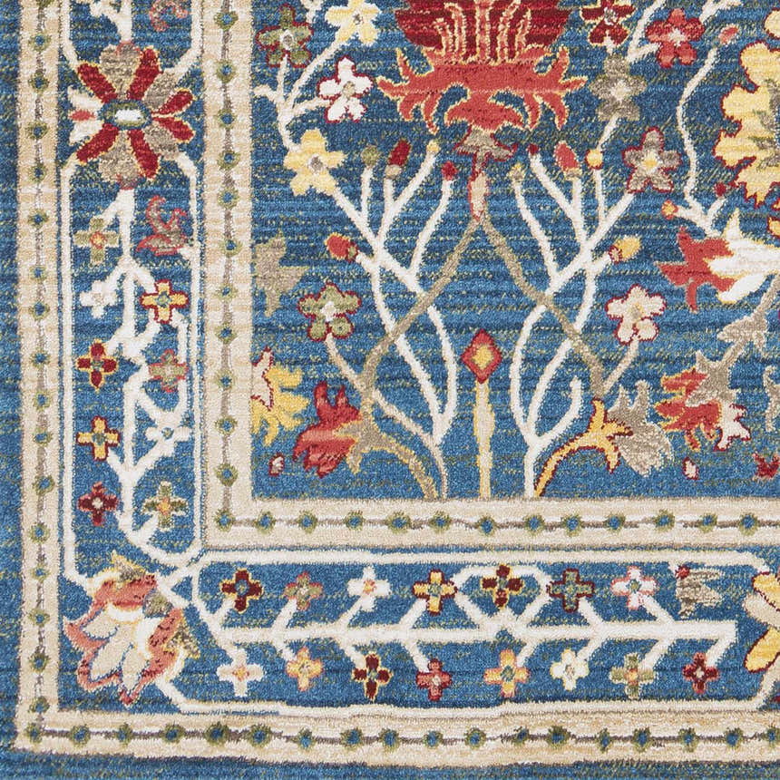Close-up of the Neola Navy Blue Damask Area Rug featuring a floral pattern in red, yellow, and tan on a navy background. Swatch