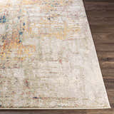 Close-up of the Birchgrove Area Rug showing its cream base and brick red, mustard, and navy abstract design. Front