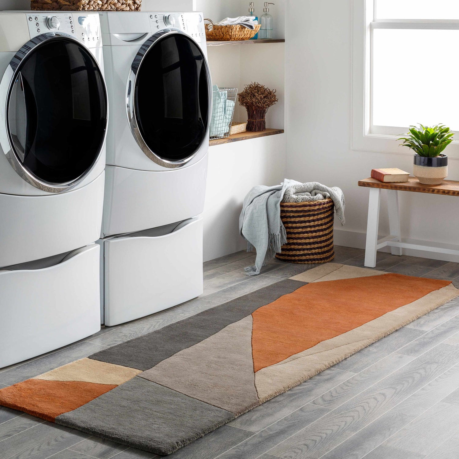 Modern laundry room with a Bracknell wool rug in brick red, gray, and tan, complementing the gray wood-look tile floor. Roomscene-Runner
