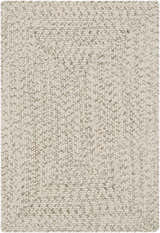 Close-up of a Beige Braided Faux Jute Rug. The rug has a braided texture with bleached jute, brown, charcoal, and cream colors. Design-Rectangle-23