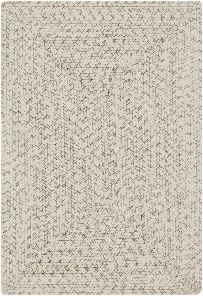 Close-up of a Beige Braided Faux Jute Rug. The rug has a braided texture with bleached jute, brown, charcoal, and cream colors. Design-Rectangle-23