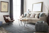 Living room scene with Pensacola 5x8 Charcoal rug, sofa, leather chair, and modern decor. Contemporary style. Roomscene-Rectangle