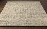 Close-up of the hand-loomed Burlington Clearance Rug in oatmeal and sage, featuring a geometric pattern and textured design. Front