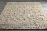 Close-up of the Burlington Clearance Rug showing a raised geometric pattern in dusty sage and oatmeal tones. Styleshot
