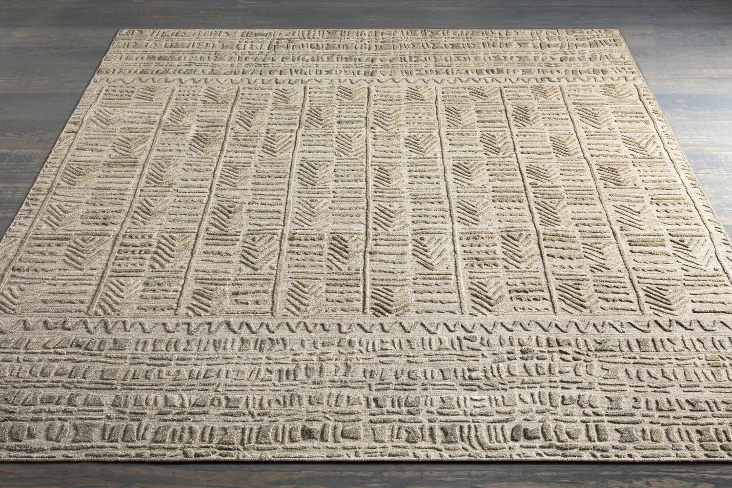 Close-up of the Burlington Clearance Rug showing a raised geometric pattern in dusty sage and oatmeal tones. Styleshot