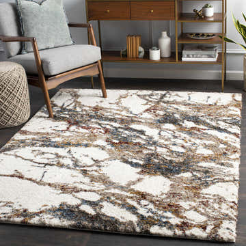 Living room scene with Bremen Beige Marble Plush Carpet, gray chair, and wood console table. Roomscene-Rectangle