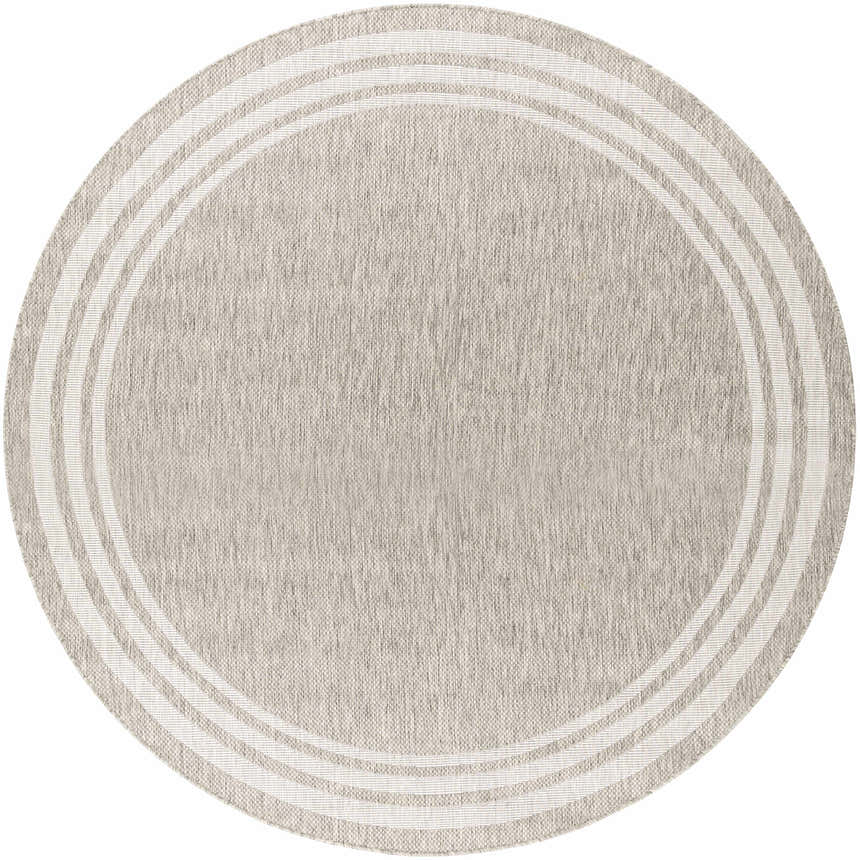 Close-up of a round Burradoo Bordered Area Rug. Oatmeal color with a concentric striped border. Machine woven polypropylene. Design-Round-710