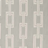 Close-up of Brundidge Area Carpet: Gray wool rug with an ivory geometric chain-link pattern. Hand-woven texture. Swatch