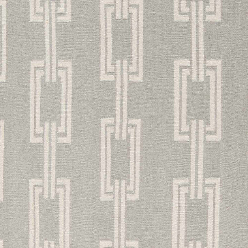 Close-up of Brundidge Area Carpet: Gray wool rug with an ivory geometric chain-link pattern. Hand-woven texture. Swatch