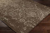 Close-up of the Bryce Area Rug, a hand-knotted wool rug with a traditional brown and beige floral pattern. Corner