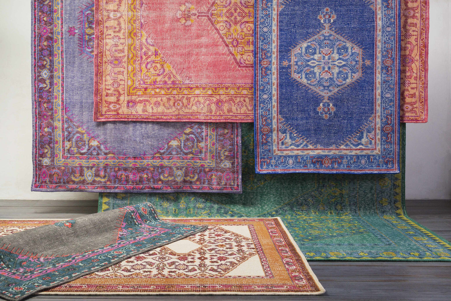 Assorted Bethesda Area Rugs in burgundy, pink, gray, and seafoam, hand-knotted wool rugs. Styleshot