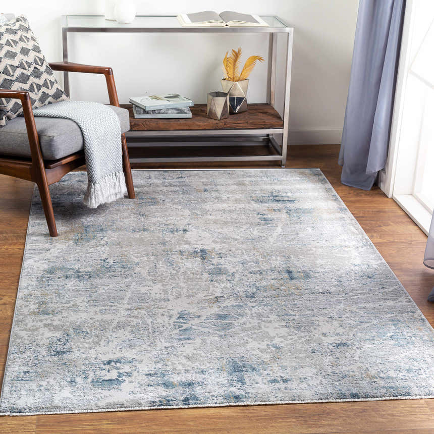 Living room scene with a Burstwick Thick Luxe Boutique Rug in dusty sage, navy, and taupe under a wood chair and console table. Roomscene-Rectangle
