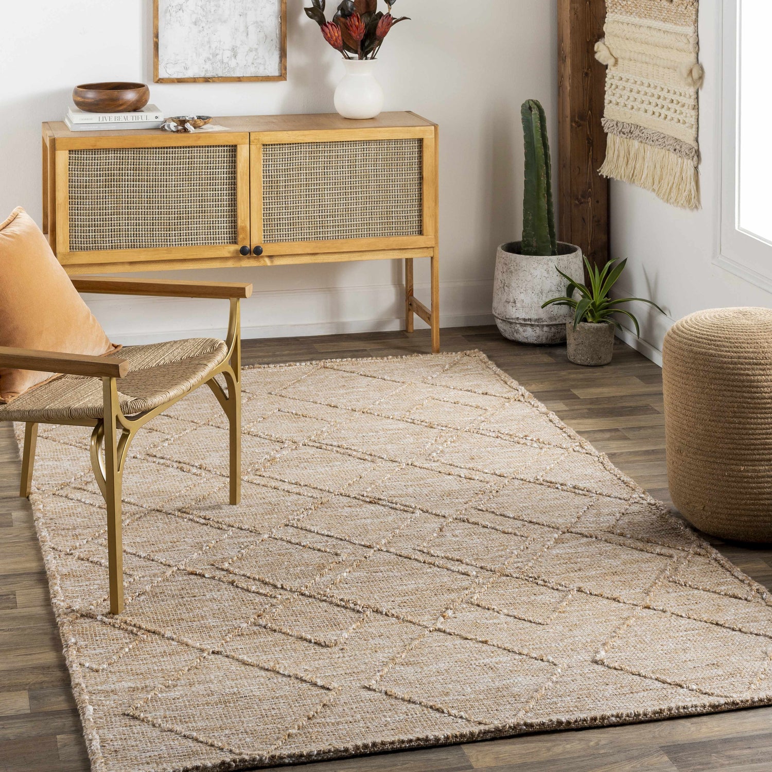 Bohemian living room with a Buse Hand Woven Beige Area Rug, woven chair, and natural wood accents. Roomscene-Rectangle
