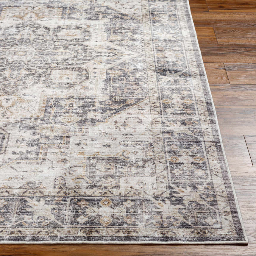 Close-up of the Bevin Washable Area Rug, a farmhouse style rug with a traditional gray, brown, and taupe pattern. Front