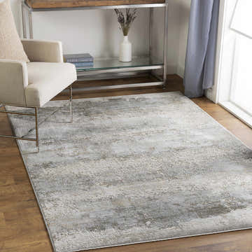 Living room scene with a Bowdoinham Thick Luxe Boutique Rug in charcoal, sage, and gray tones. Modern chair and console table. Roomscene-Rectangle