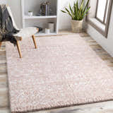 Light and airy room scene with a blush and cream Plush Area Rug, chair, bookshelf, and wood floors. Roomscene-Rectangle