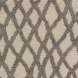 Close-up of Clare Area Carpet. Hand woven wool shag rug with charcoal diamond pattern on a medium gray background. Swatch