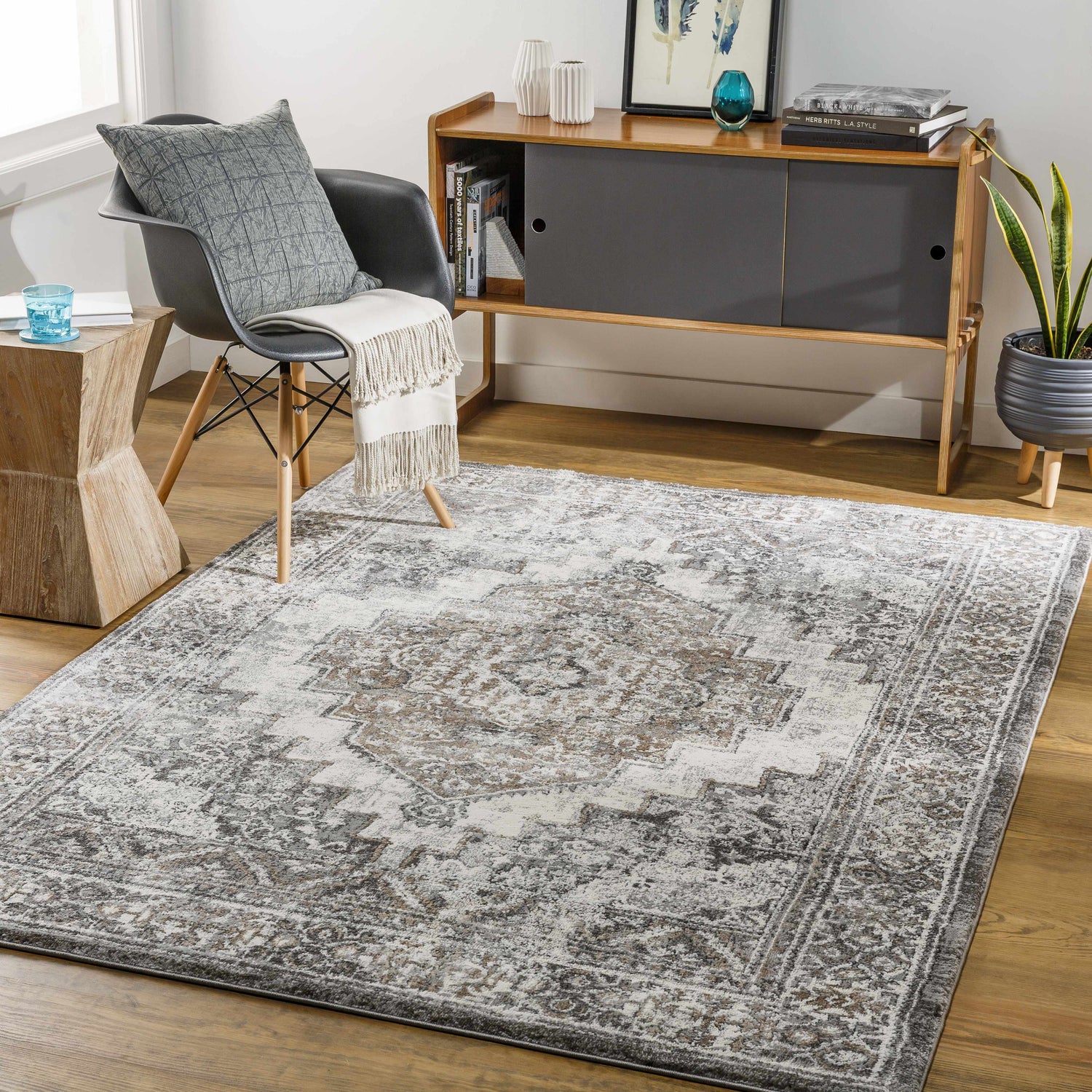 Living room scene with a Manaring Charcoal Luxe Thick Area Rug, gray chair, and mid-century modern cabinet. Roomscene-Rectangle