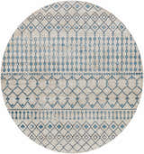 Close-up of round Cabognon Washable Area Rug. Geometric pattern in blue, ink blue, light beige, and light gray. Design-Round-67