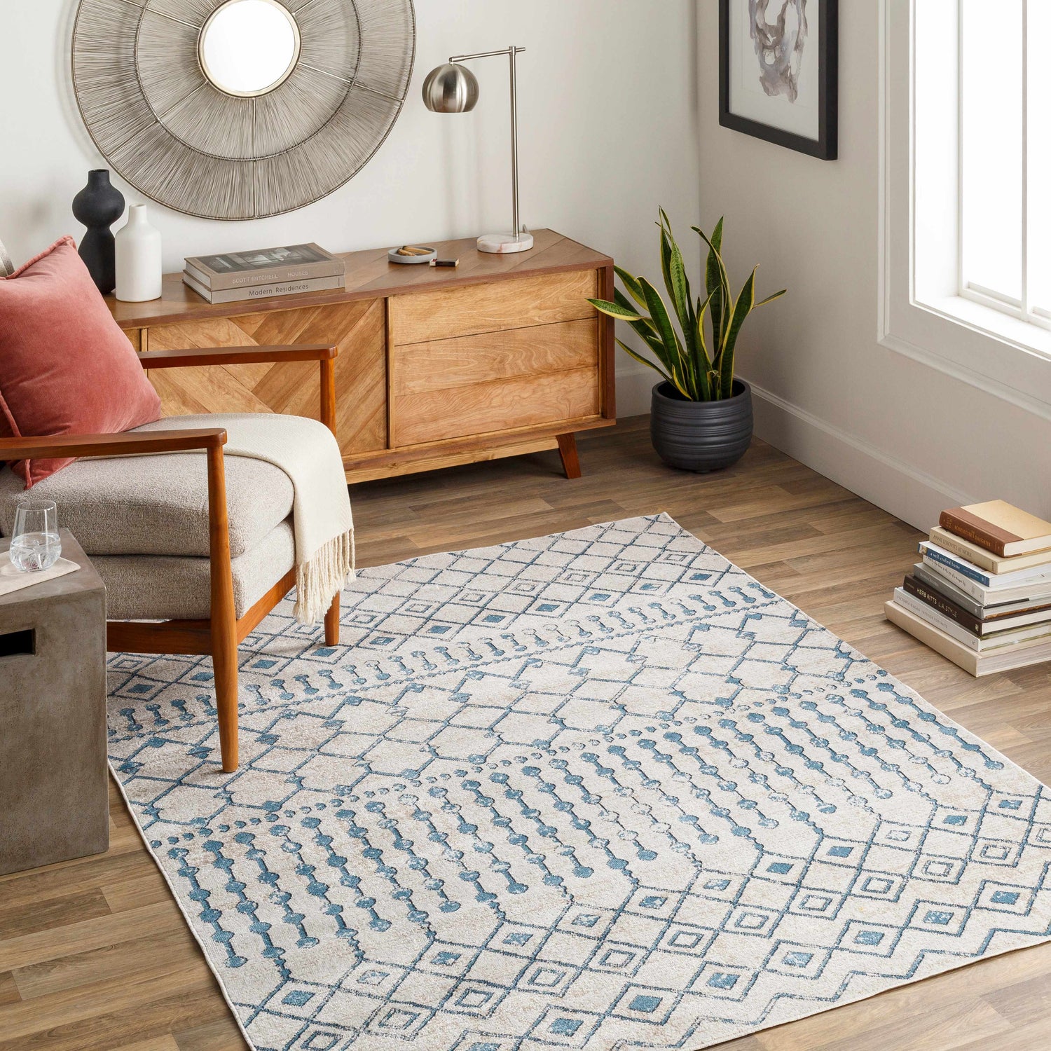 Living room scene with a blue and beige geometric Cabognon Washable Area Rug, wood furniture, and modern decor. Roomscene-Rectangle