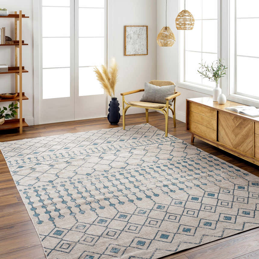 Bright living room with blue geometric Cabognon Washable Area Rug, wood floors, and farmhouse decor. Roomscene-Rectangle