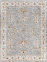 Close-up of the Camrose Thick Luxe Statement Rug. Denim blue rug with traditional floral and geometric patterns in light beige and rust. Design-Rectangle-710103