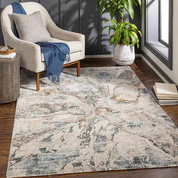 Living room scene with a Cardup Beige Marble Rug, accent chair, and dark wood floors. Roomscene-Rectangle