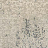 Close-up of the Cayuga Area Rug showing its hand-knotted silk texture and contemporary dark blue, sage, and off-white design. Swatch
