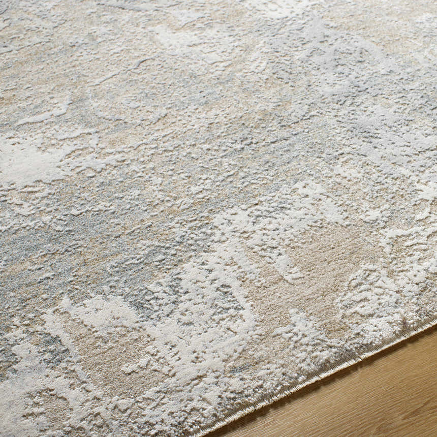 Close-up of the Cady Thick Luxe Area Rug. Abstract design in cloud gray, light gray, and medium brown tones. Soft, plush texture. Texture