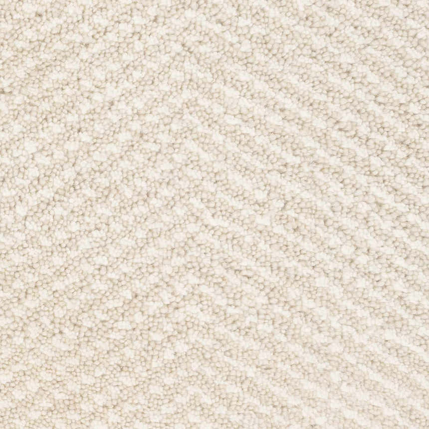 Close-up of the Ceiba Carpet showing a textured, hand-knotted weave in beige and ivory. Contemporary style. Swatch