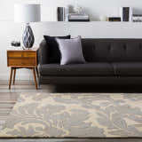 Living room scene with gray sofa and Cementon Area Rug in gray and ivory floral pattern. Roomscene-Rectangle