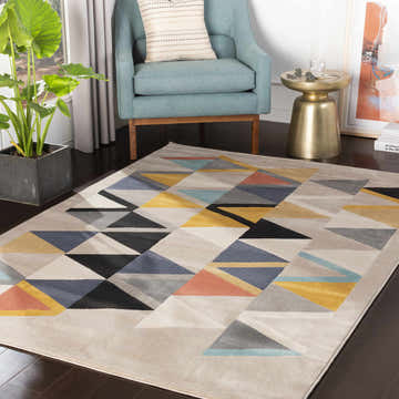 Living room scene with geometric Champlin Area Rug, aqua chair, gold side table, and potted plant. Contemporary style. Roomscene-Rectangle