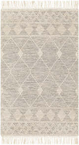 Close up of the Hemingway Wool Rug with Tassels. Bone and gray rug with geometric diamond pattern and fringe. Design-Rectangle-58
