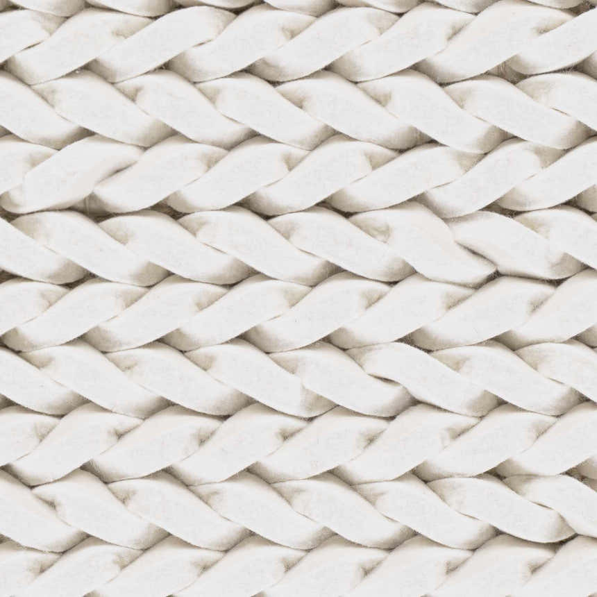 Close-up of the cream Christoval Area Rug showing its hand-woven, chunky braided wool texture. Swatch