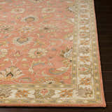 Close-up of the Caesar Hand Tufted Burnt Orange Wool Carpet. Features a floral pattern with brick red, brown, and taupe accents. Front