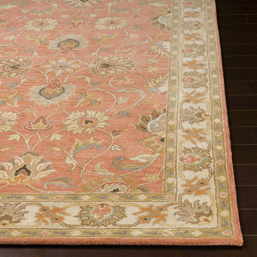 Close-up of the Caesar Hand Tufted Burnt Orange Wool Carpet. Features a floral pattern with brick red, brown, and taupe accents. Front