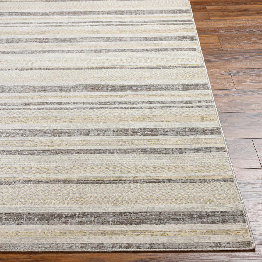 Close-up of Chato Area Rug showing bone, gray, nutmeg, and white thatch stripes on a wood floor. Geometric, coastal style. Front