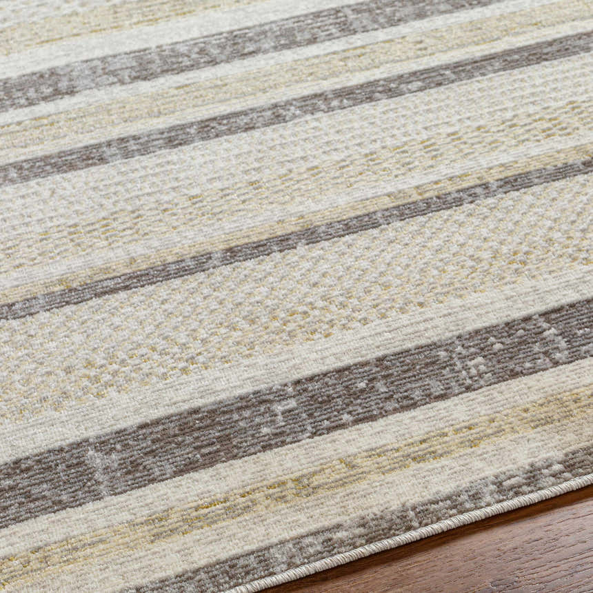 Close up of Chato Area Rug showing bone, gray, nutmeg, and white thatch stripes and textured machine woven construction. Texture