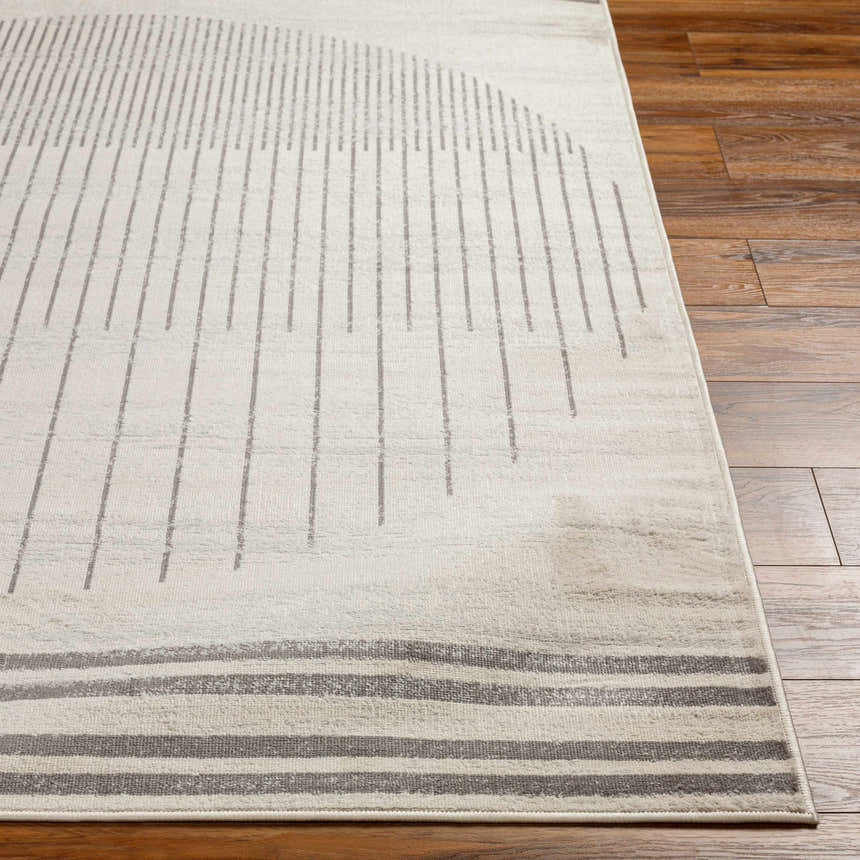 Close-up of Chet Area Rug in cloud gray. Features a geometric pattern with vertical and horizontal lines. Front