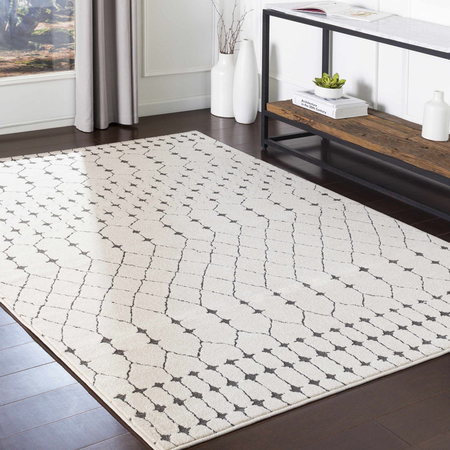 Living room with Chubbuck Moroccan Trellis Rug in charcoal and light beige, styled with a console table and dark wood floors. Roomscene-Rectangle