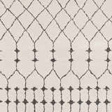 Close-up of Chubbuck Moroccan Trellis Rug. Charcoal trellis pattern on light beige background. Bohemian style. Texture