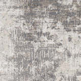 Close-up of the Calabasa Area Rug showing its charcoal, gray, and light gray contemporary pattern and machine woven texture. Swatch