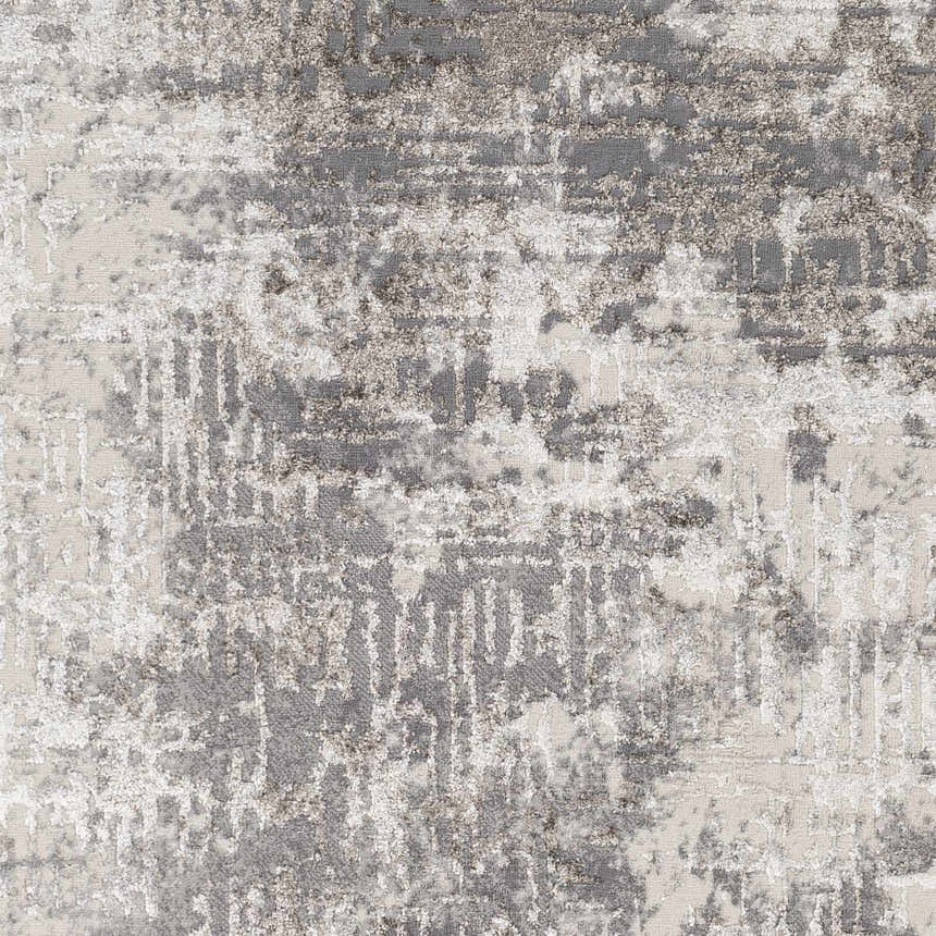 Close-up of the Calabasa Area Rug showing its charcoal, gray, and light gray contemporary pattern and machine woven texture. Swatch