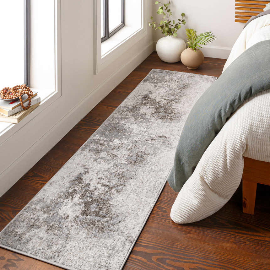 Bedroom scene with gray and charcoal Calabasa Area Rug runner, wood floors, and natural light. Roomscene-Runner