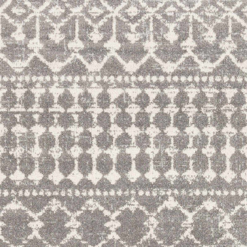 Close up of the Cliffwood Area Rug. Gray and light beige geometric pattern. Machine woven polypropylene texture. Swatch